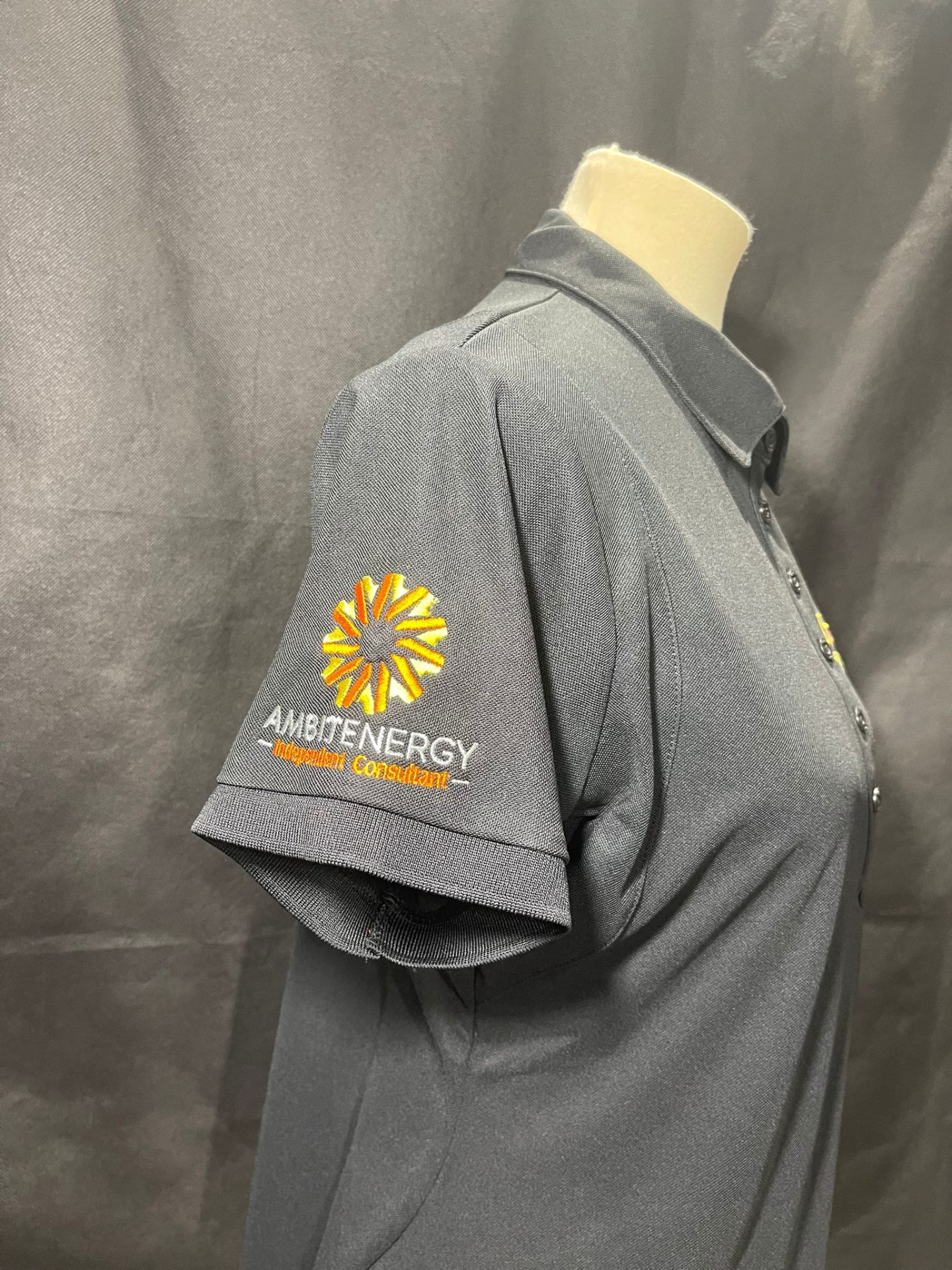 Ambit Energy embroidered work shirt sleeve